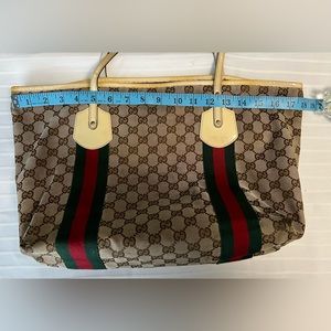 Authentic Preloved Gucci canvas tote with red/green line and cream patent trim.